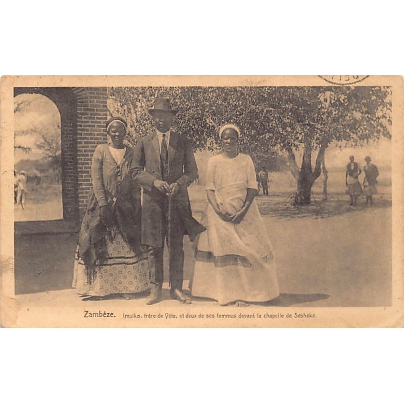 Zambia - BAROTSELAND - Imwiko (spelled Imulko), brother of King Yeta III, with two of his wives in front of the chapel of Seshek
